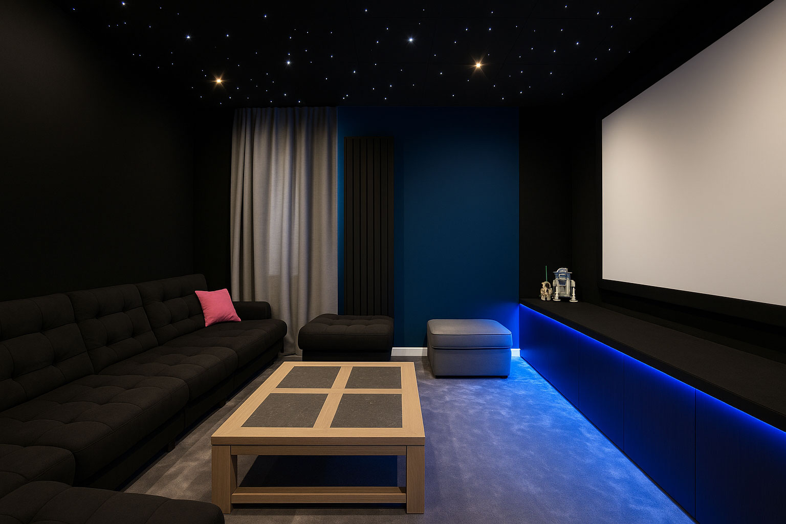 Vue générale d’un salon cinéma avec écran, canapé noir, plafond étoilé et moquette grise